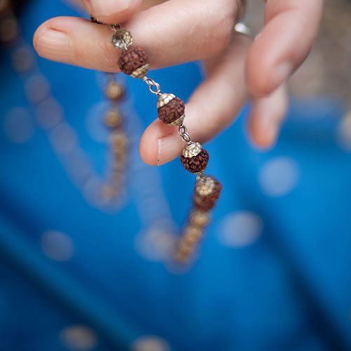 Jane Craggs holding mala beads